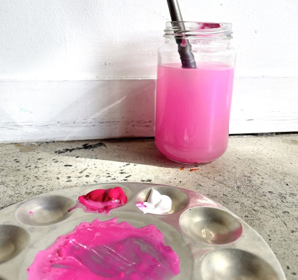 Pink water in jar and pink paint on palette - Cork and Chroma