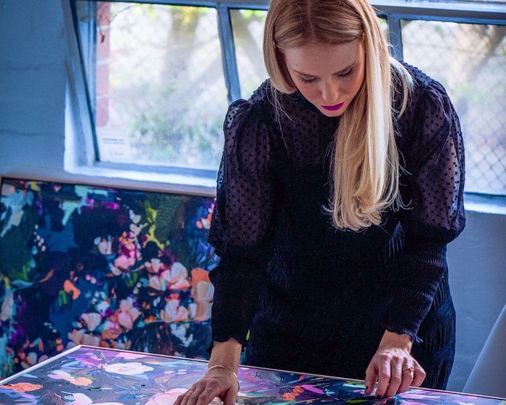 Chloé Newby with her 'Midnight Magnolias' painting collection