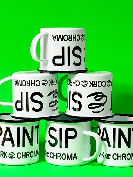 Paint & Sip Enamel Mugs by Cork & Chroma, stacked in a pyramid shape.