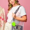 Model wearing PVC&C Tote Bag by Cork & Chroma with neon green Smol Palette Keychain