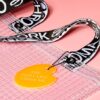 Cropped detail shot of PVC&C Tote Bag by Cork & Chroma with neon orange Smol Palette Keychain