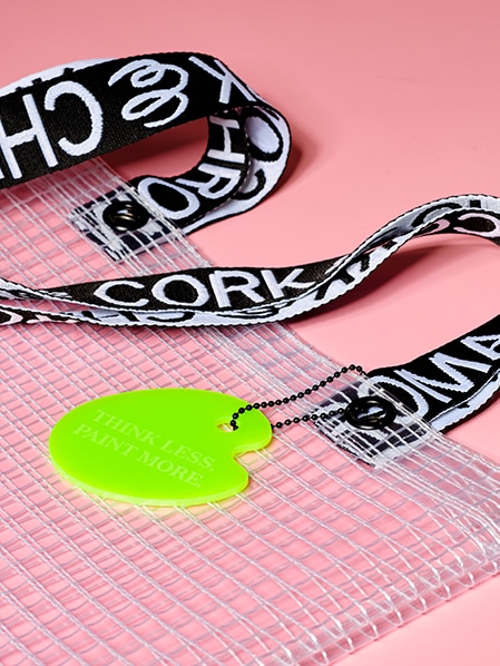Cropped detail shot of PVC&C Tote Bag by Cork & Chroma with neon green Smol Palette Keychain