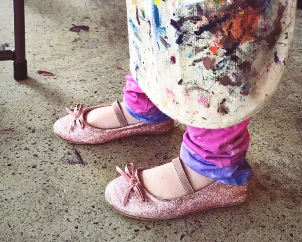 Kid's Shoes Under a Cork & Chroma Apron