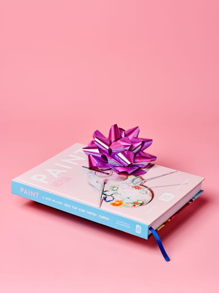'PAINT' paint and sip book with ribbon on top by Cork & Chroma